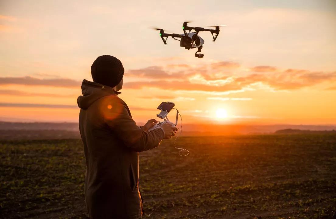 Photo of person flying drone
