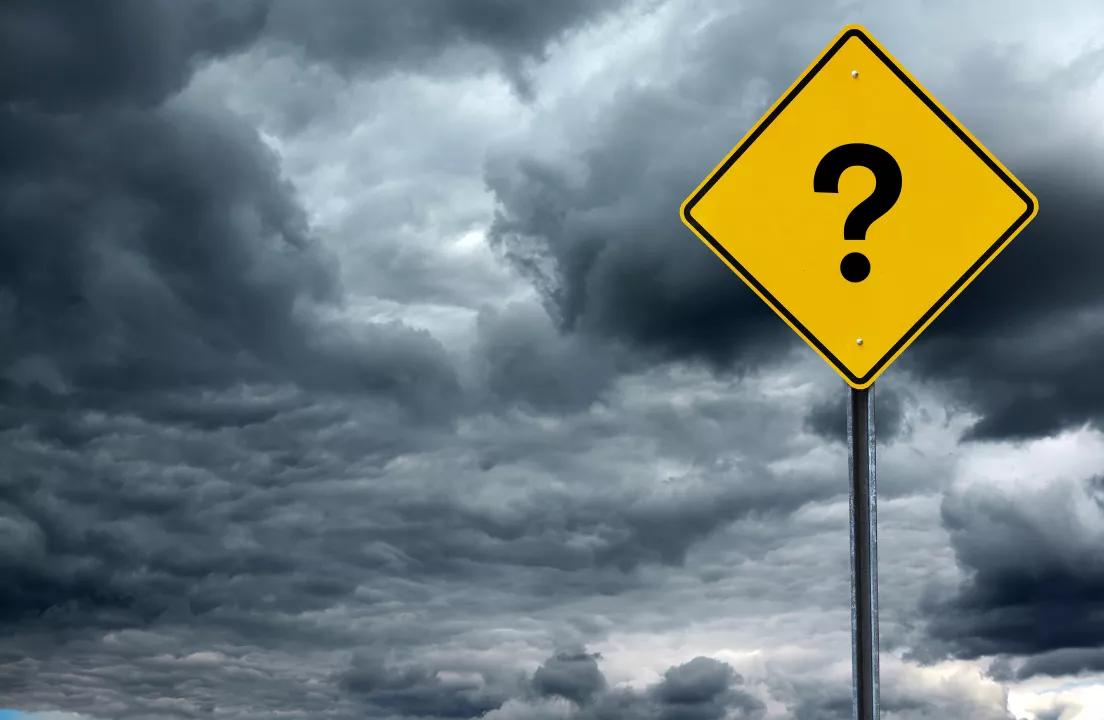 January forecast commentary featuring question mark road sign