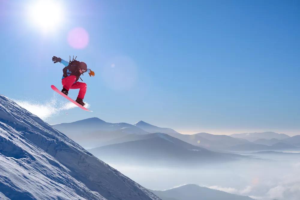 Snowboarder prepares for soft landing